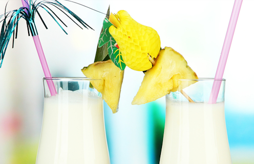 Festive Pina Coladas garnished with pineapple