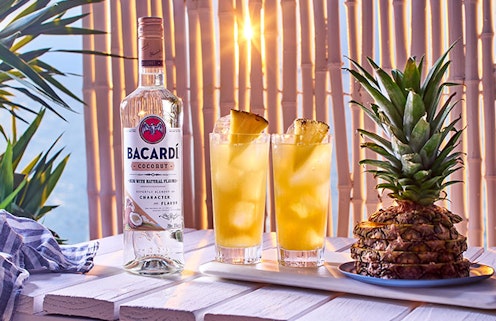 Bacardi Coconut Rum, a pineapple and two cocktails